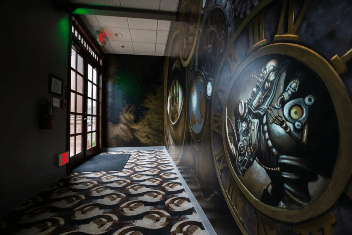 Atmospheric escape room hallway with steampunk clock mural